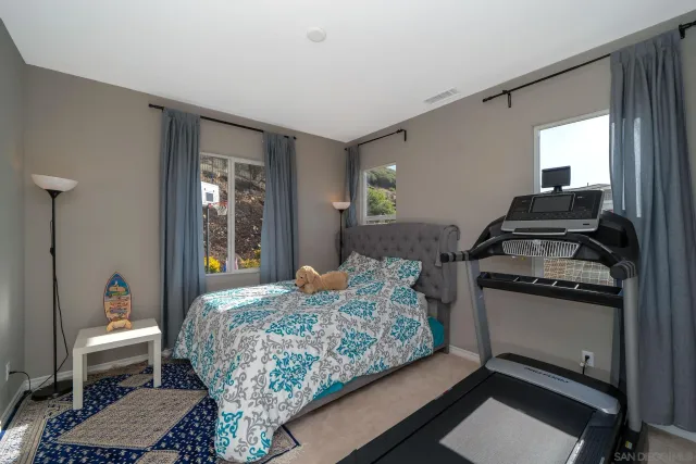 a bathroom with a sink and mirror with toilet