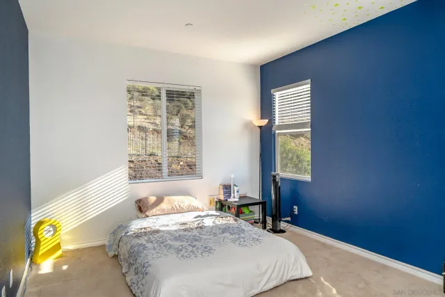 a bathroom with a bathtub shower sink vanity and toilet