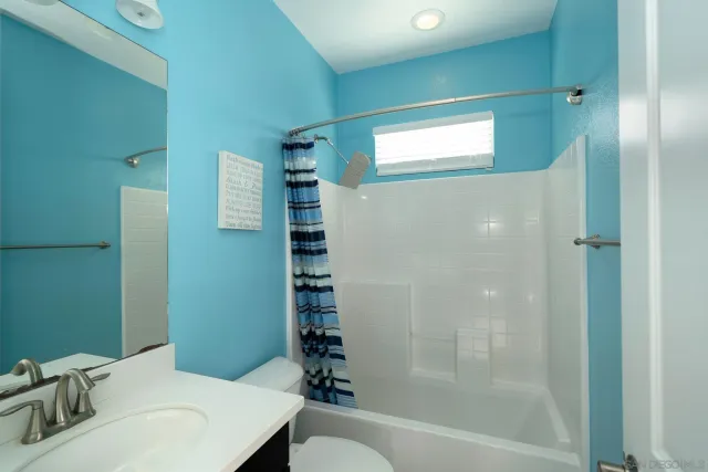 a utility room with sink dryer and washer