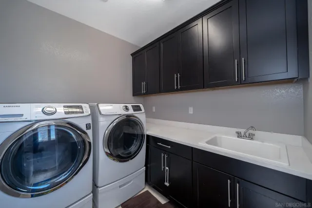 a view of backyard with outdoor seating and plants