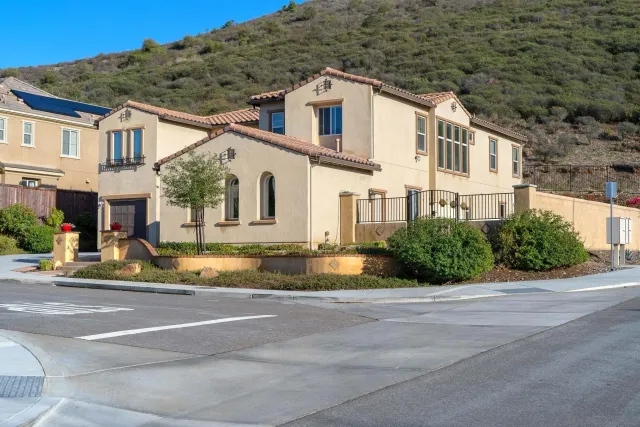 an aerial view of a house with a yard