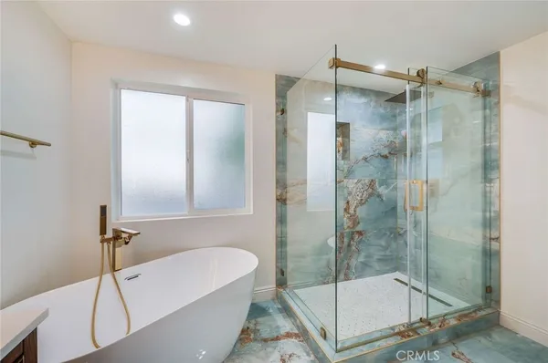 a bathroom with a shower and a bathtub