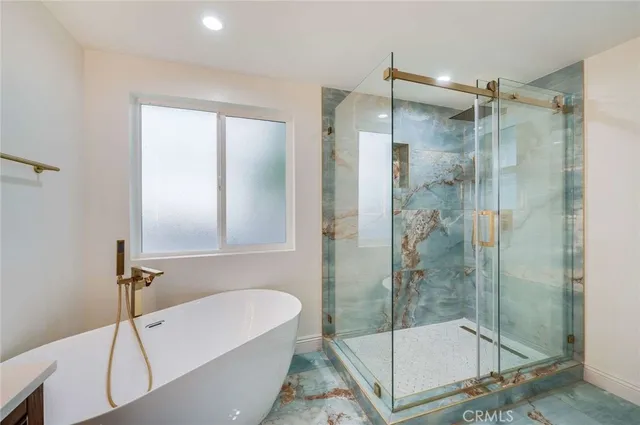 a bathroom with a shower and a bathtub