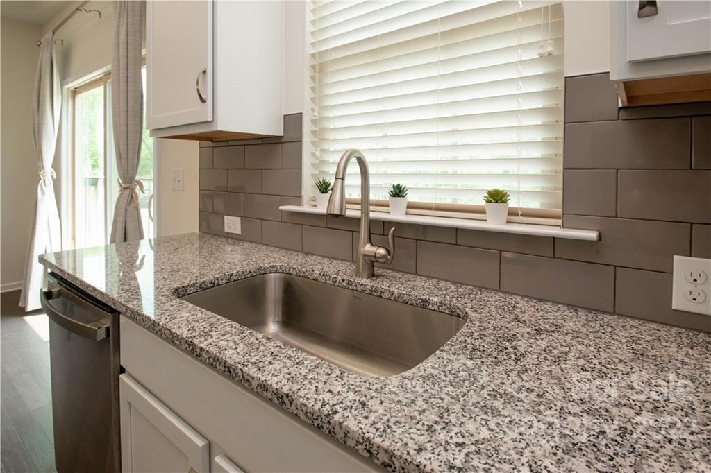 820 Ruckers Court Tega Cay, SC 29708 - Photo 13 of 46 a kitchen with a sink and a window