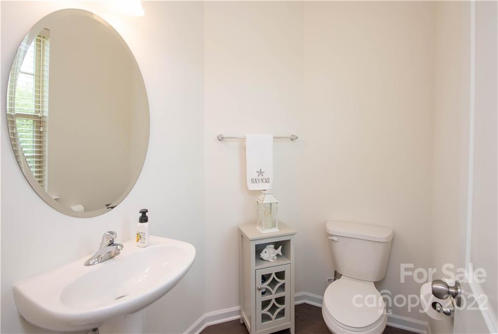 820 Ruckers Court Tega Cay, SC 29708 - Photo 22 of 46 a bathroom with a sink mirror and toilet