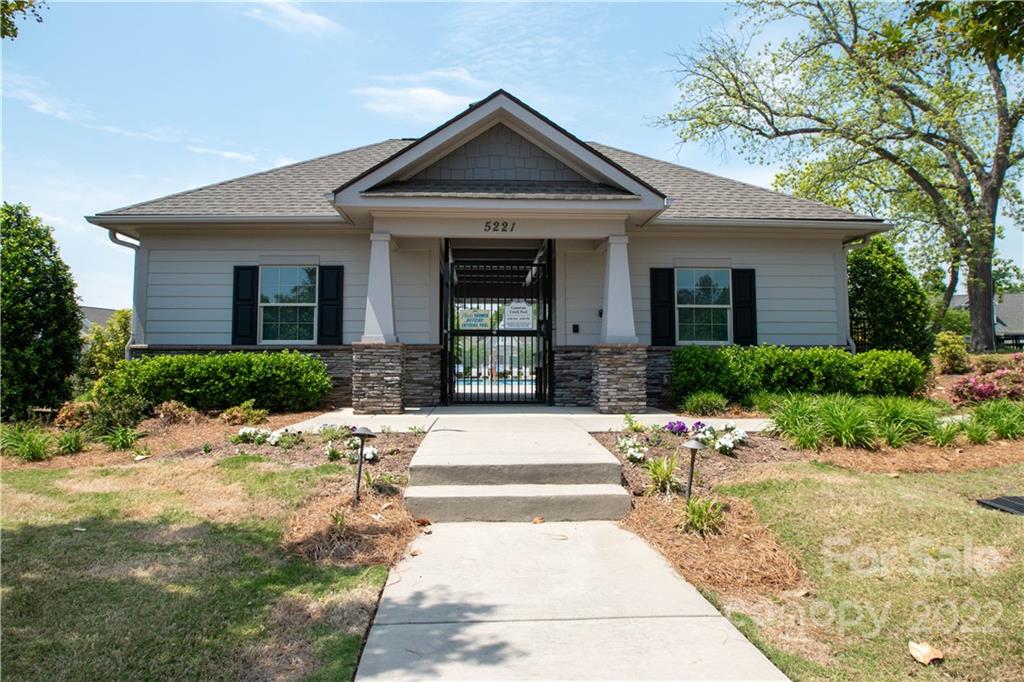 820 Ruckers Court Tega Cay, SC 29708 - Photo 41 of 46 a front view of a house with a yard outdoor seating and plants