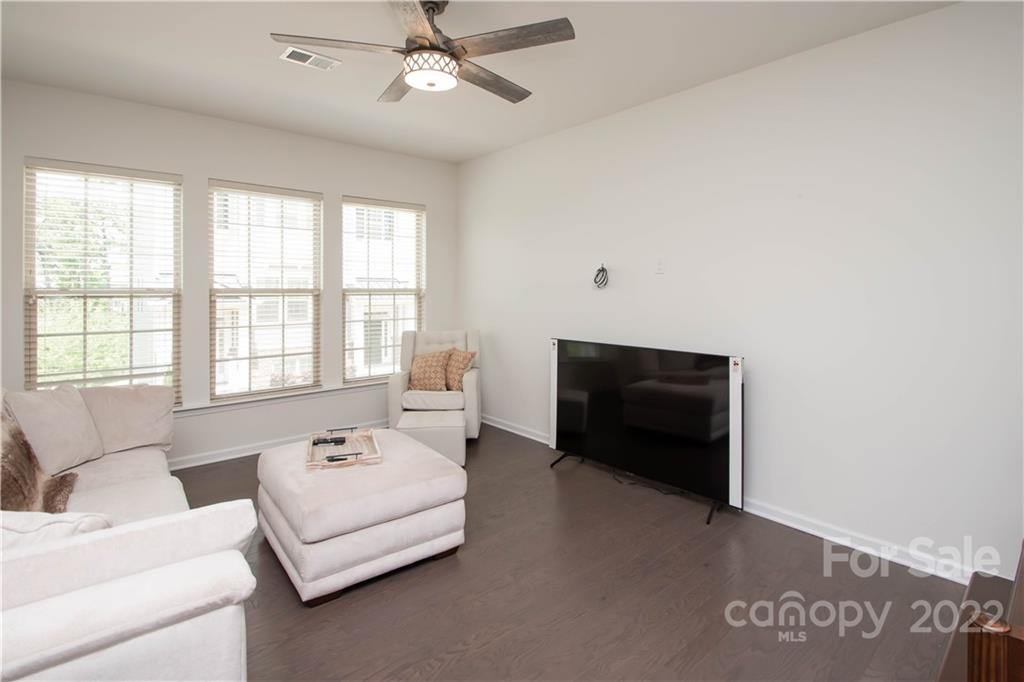 820 Ruckers Court Tega Cay, SC 29708 - Photo 6 of 46 a living room with furniture and a flat screen tv