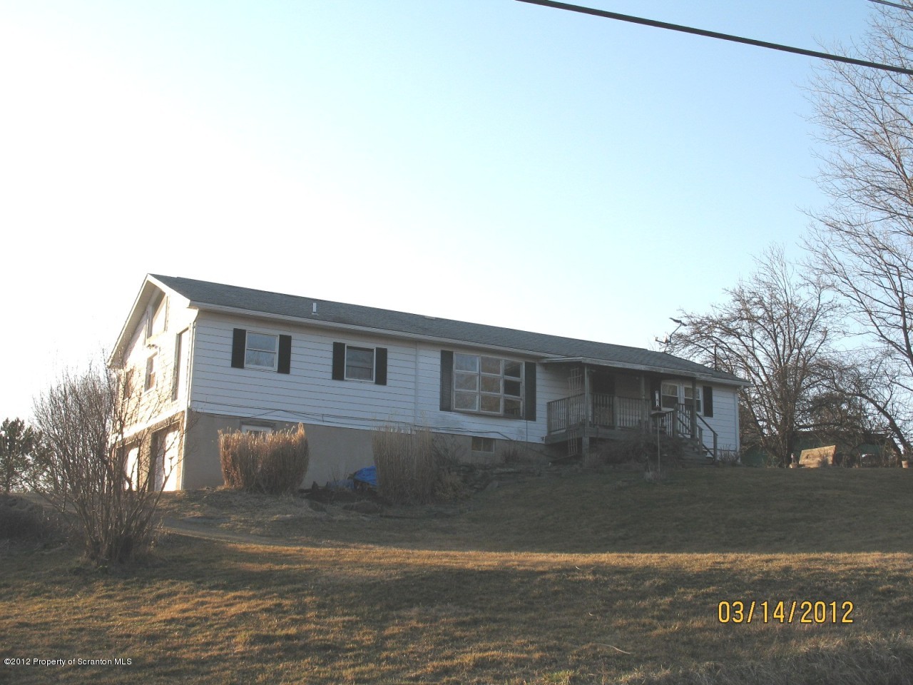 321 Cemetery Road Moscow, PA 18444 - Photo 1 of 17 a front view of a house with yard
