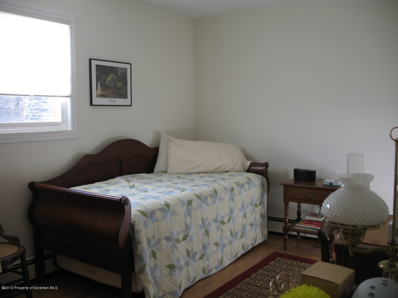 321 Cemetery Road Moscow, PA 18444 - Photo 14 of 17 a bedroom with a bed and chair