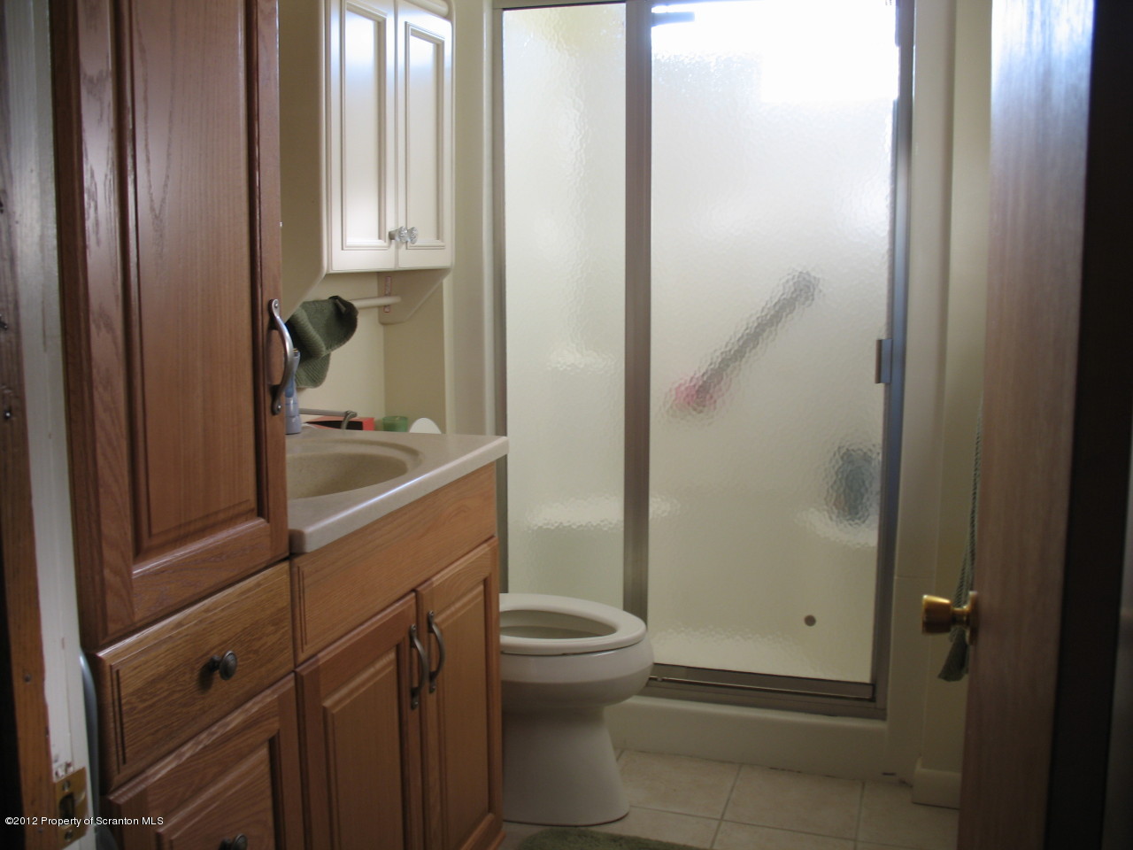 321 Cemetery Road Moscow, PA 18444 - Photo 15 of 17 a bathroom with a sink a toilet and shower