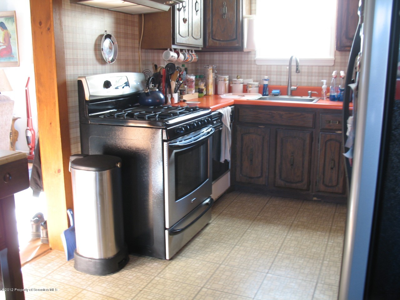 321 Cemetery Road Moscow, PA 18444 - Photo 6 of 17 a kitchen with stainless steel appliances granite countertop a stove and a sink
