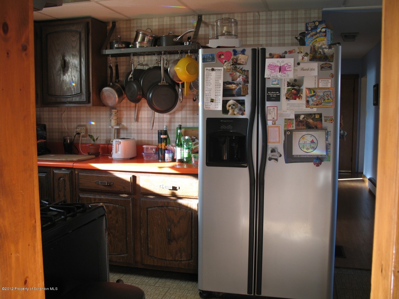 321 Cemetery Road Moscow, PA 18444 - Photo 7 of 17 a kitchen with refrigerator and cabinets