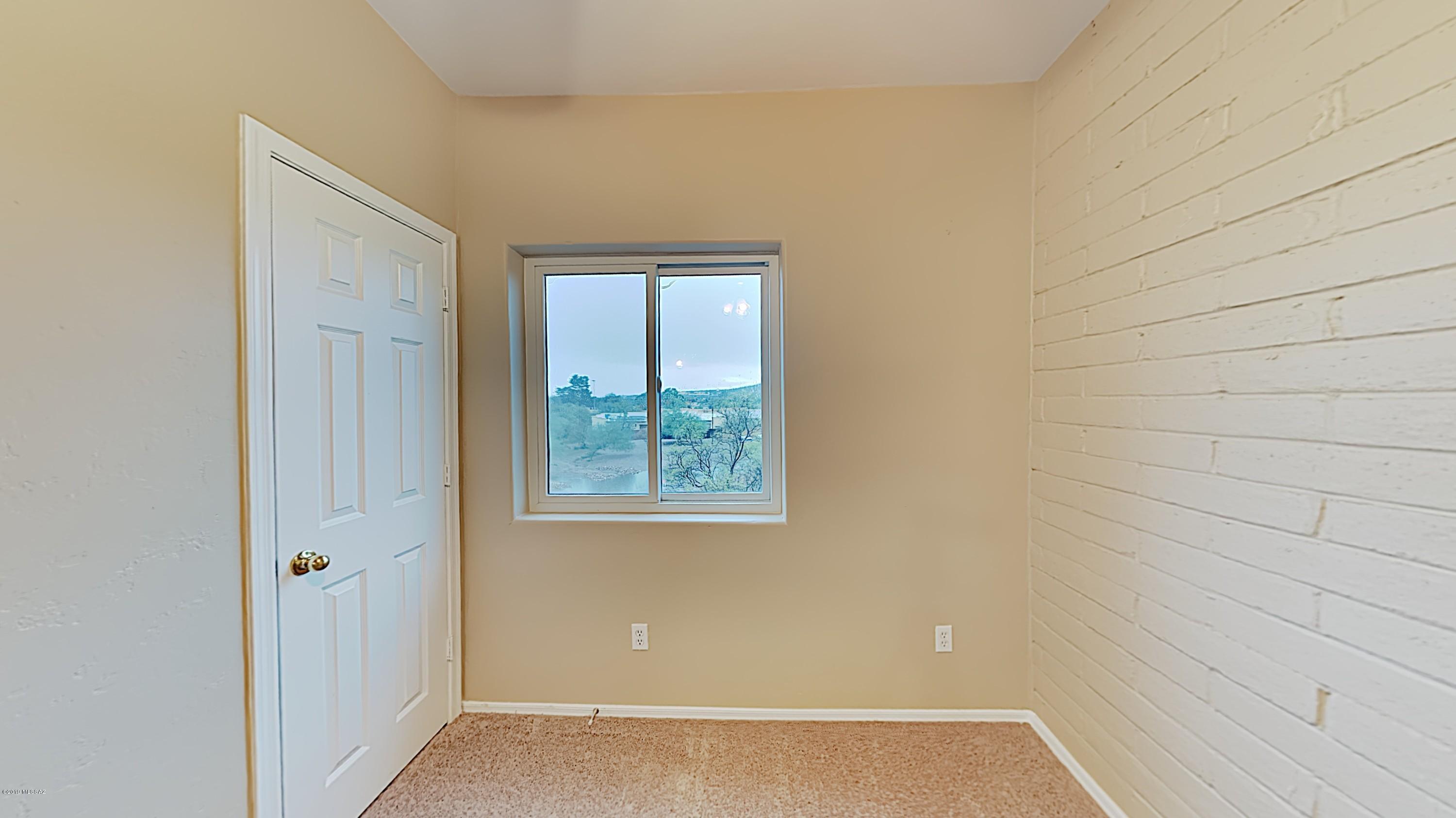 3516 South Mission Road, Unit 3 Tucson, AZ 85713 - Photo 15 of 19 a view of an empty room with windows