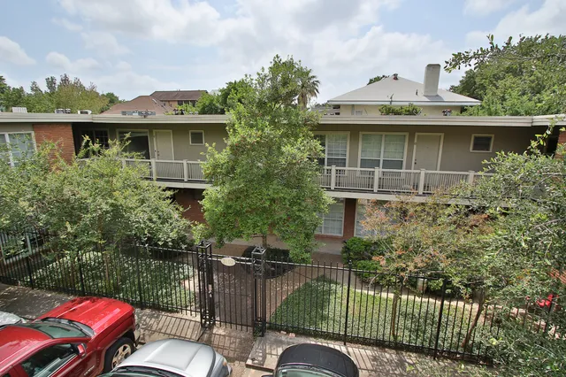 a view of a house with a chairs in patio