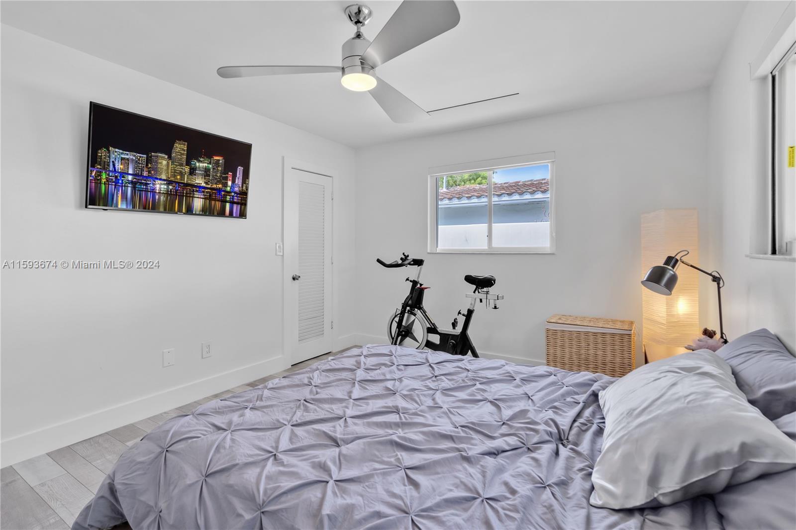 6341 Lake June Road Miami Lakes, FL 33014 - Photo 16 of 55 a bedroom with bed and a window