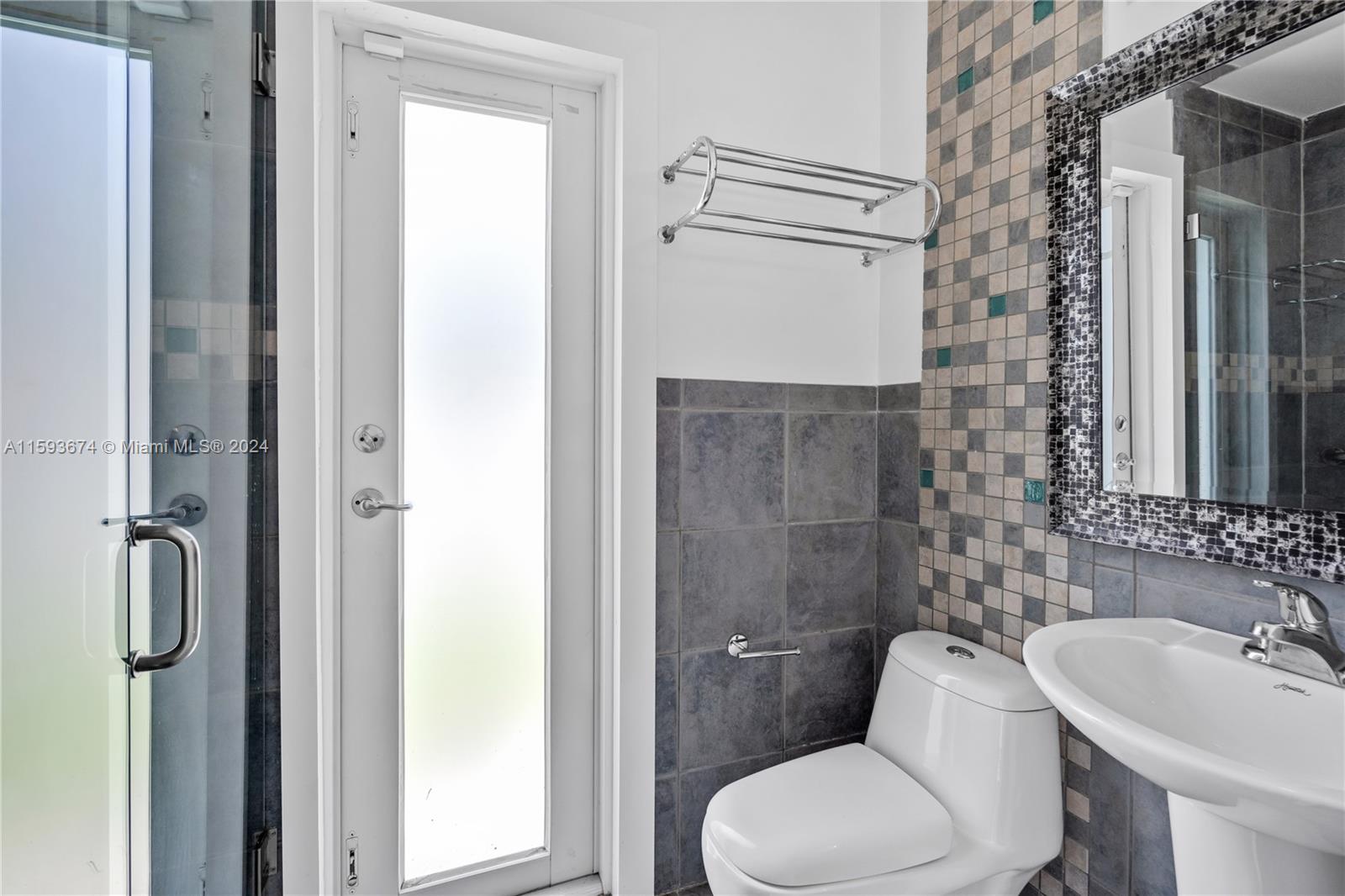 6341 Lake June Road Miami Lakes, FL 33014 - Photo 22 of 55 a bathroom with a toilet sink and shower