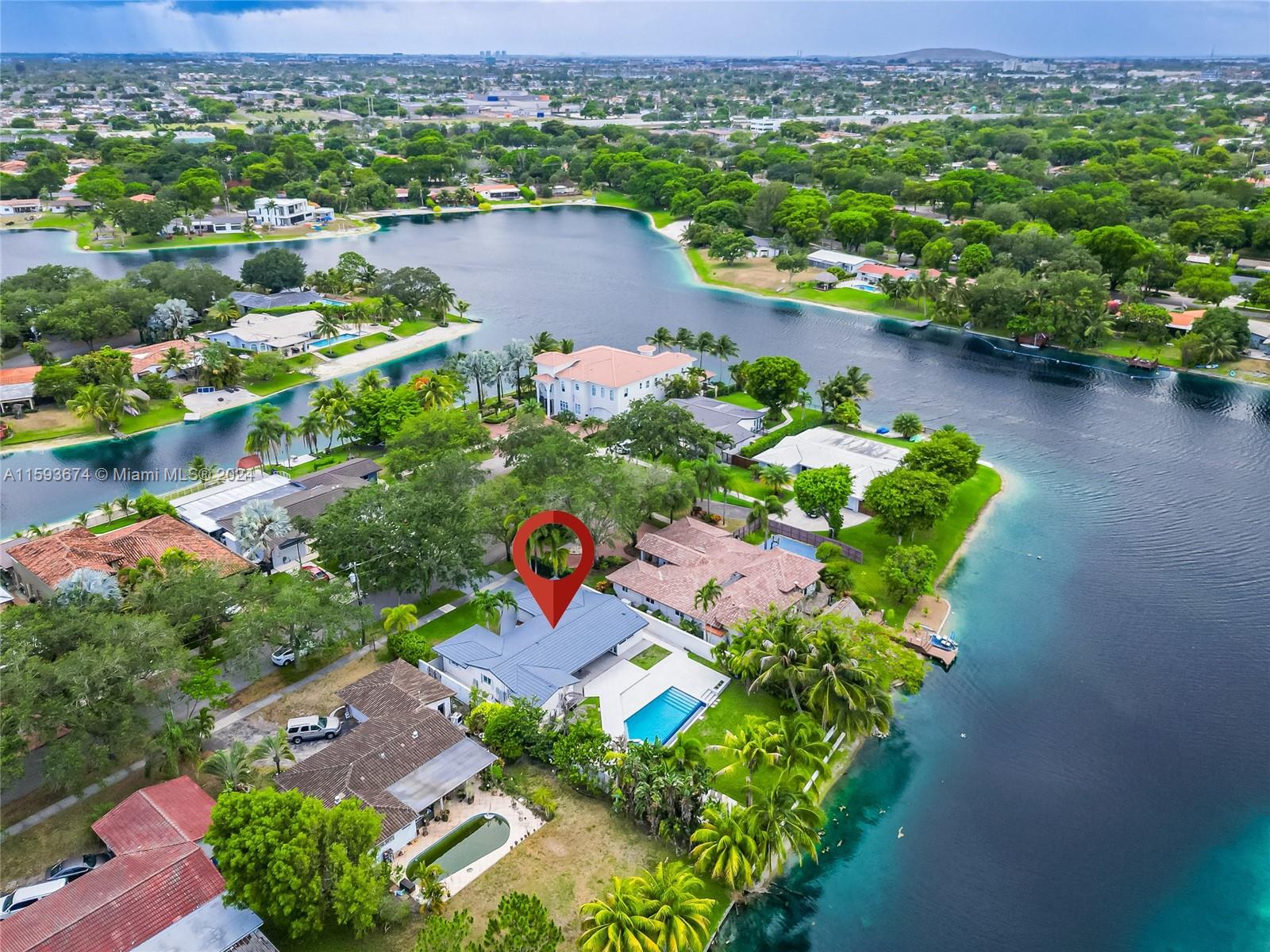 6341 Lake June Road Miami Lakes, FL 33014 - Photo 47 of 55 an aerial view of a house with a lake view