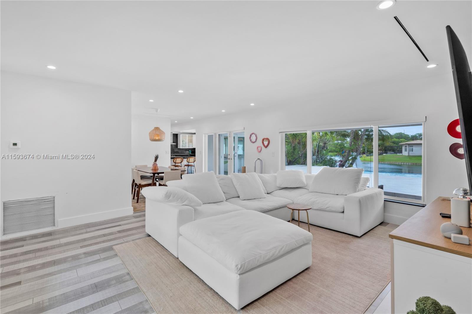 6341 Lake June Road Miami Lakes, FL 33014 - Photo 6 of 55 a living room with furniture and a large window