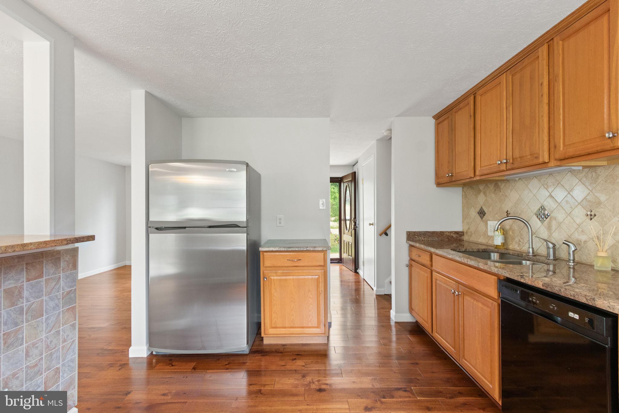 3 Cherry Laurel Drive Fredericksburg, VA 22405 - Photo 13 of 42 a kitchen with stainless steel appliances granite countertop a refrigerator and a sink