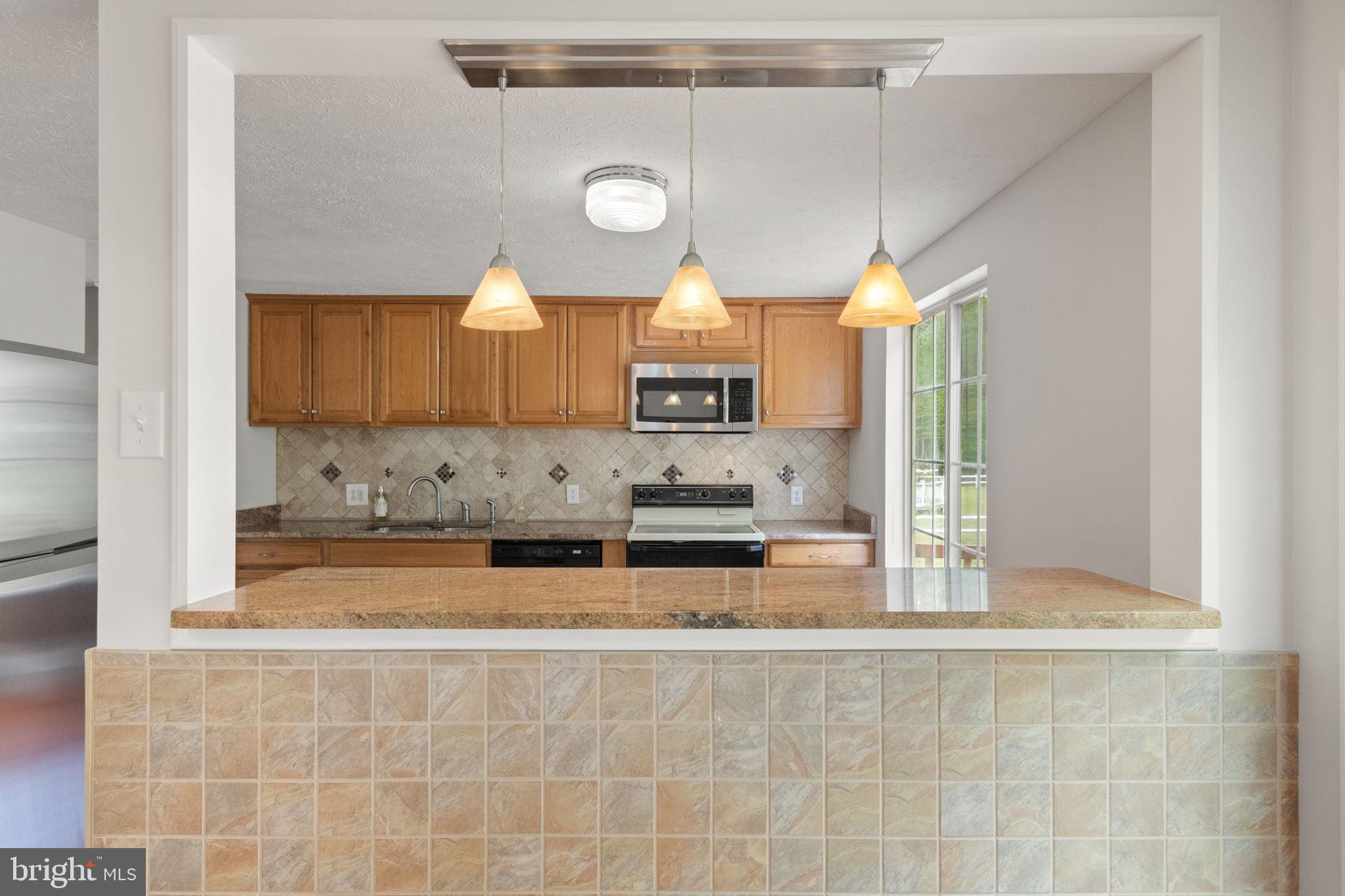 3 Cherry Laurel Drive Fredericksburg, VA 22405 - Photo 14 of 42 a view of a kitchen with a sink cabinets and a window