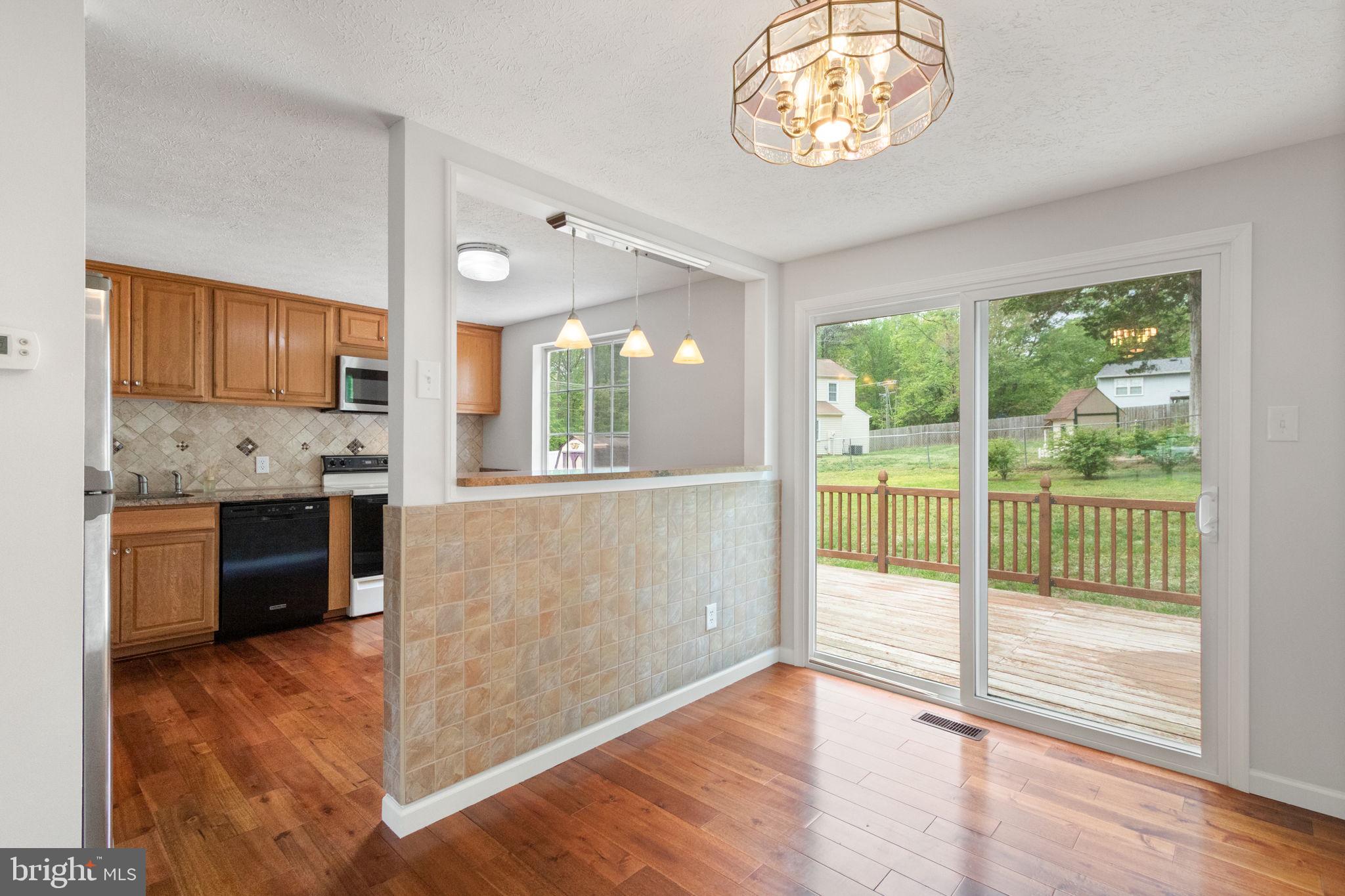 3 Cherry Laurel Drive Fredericksburg, VA 22405 - Photo 15 of 42 a view of kitchen with granite countertop cabinets and outdoor space
