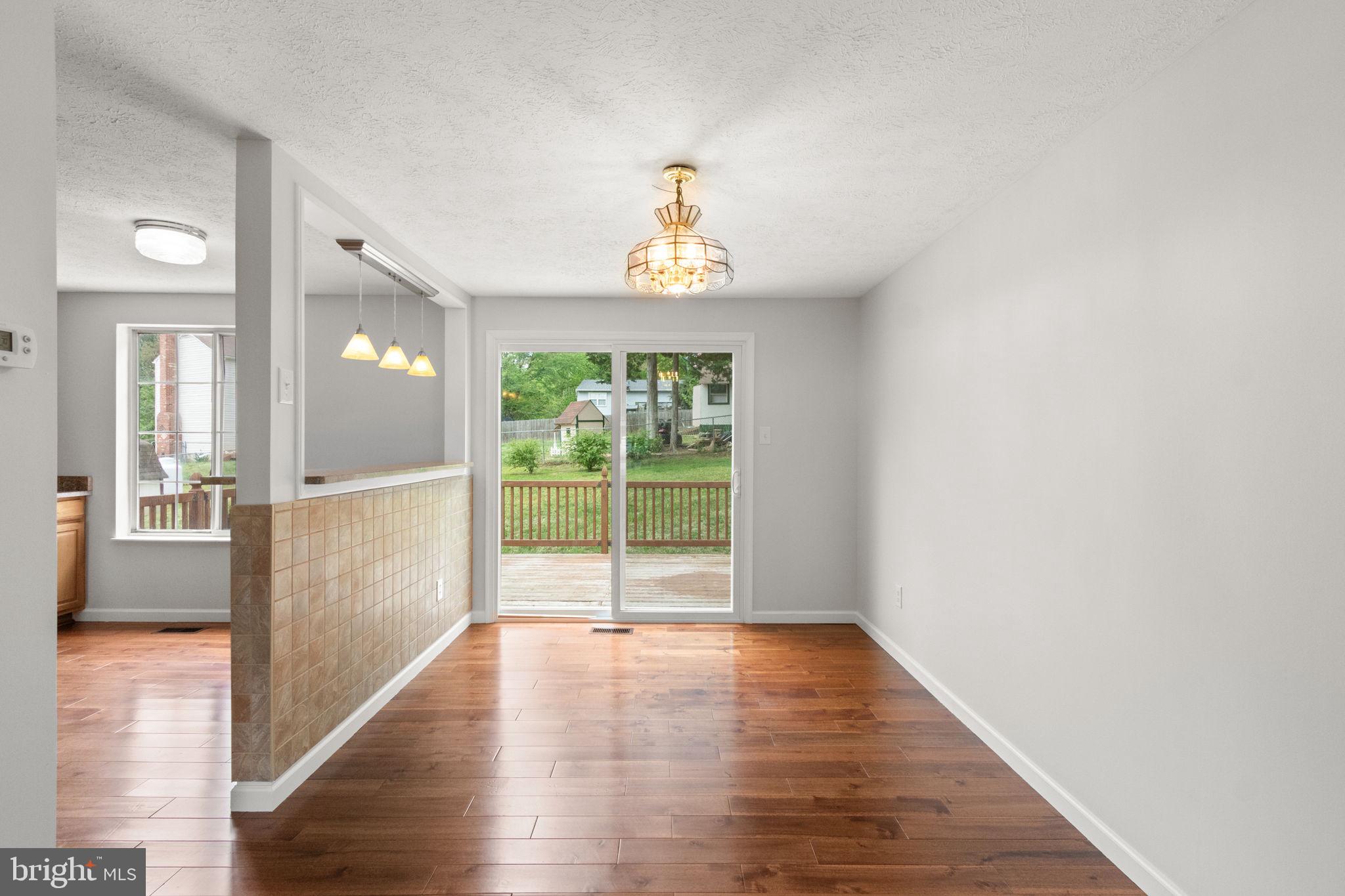3 Cherry Laurel Drive Fredericksburg, VA 22405 - Photo 16 of 42 a view of an empty room with wooden floor and a window