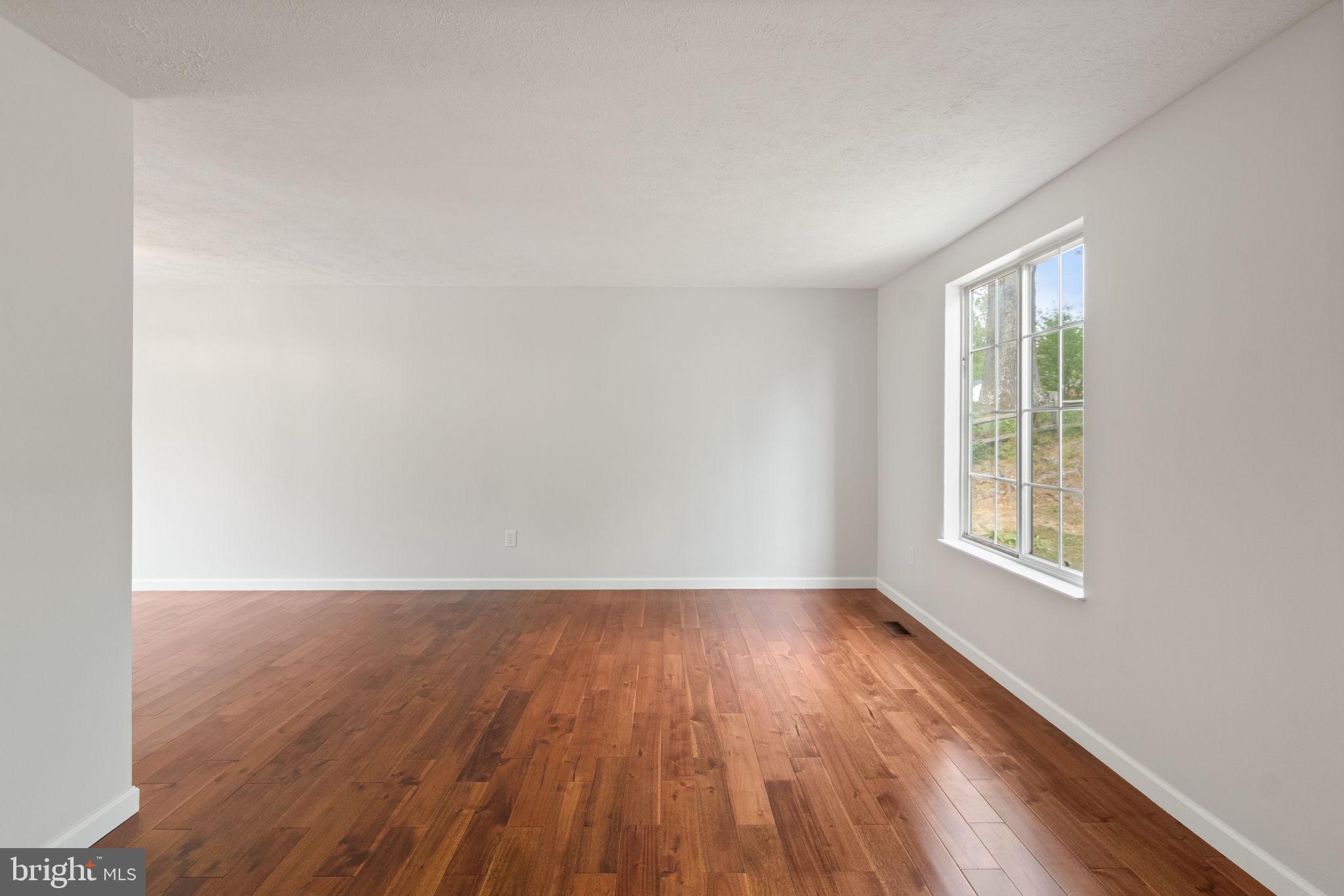 3 Cherry Laurel Drive Fredericksburg, VA 22405 - Photo 18 of 42 an empty room with wooden floor and windows