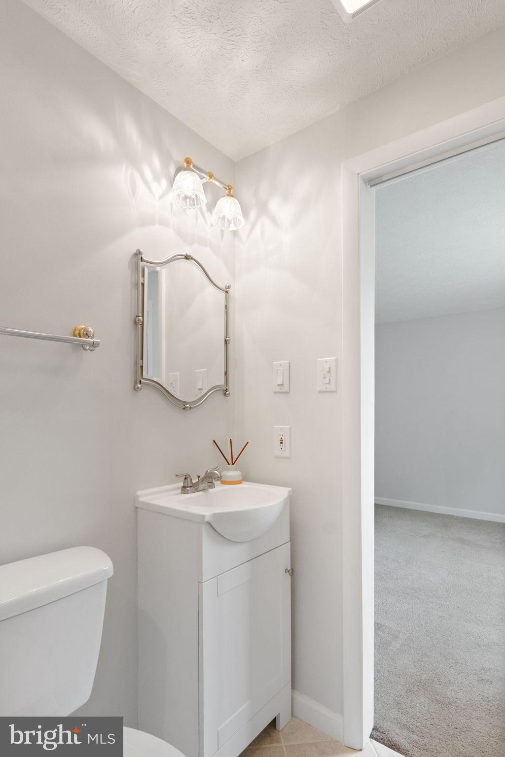 3 Cherry Laurel Drive Fredericksburg, VA 22405 - Photo 23 of 42 a bathroom with a sink toilet and mirror