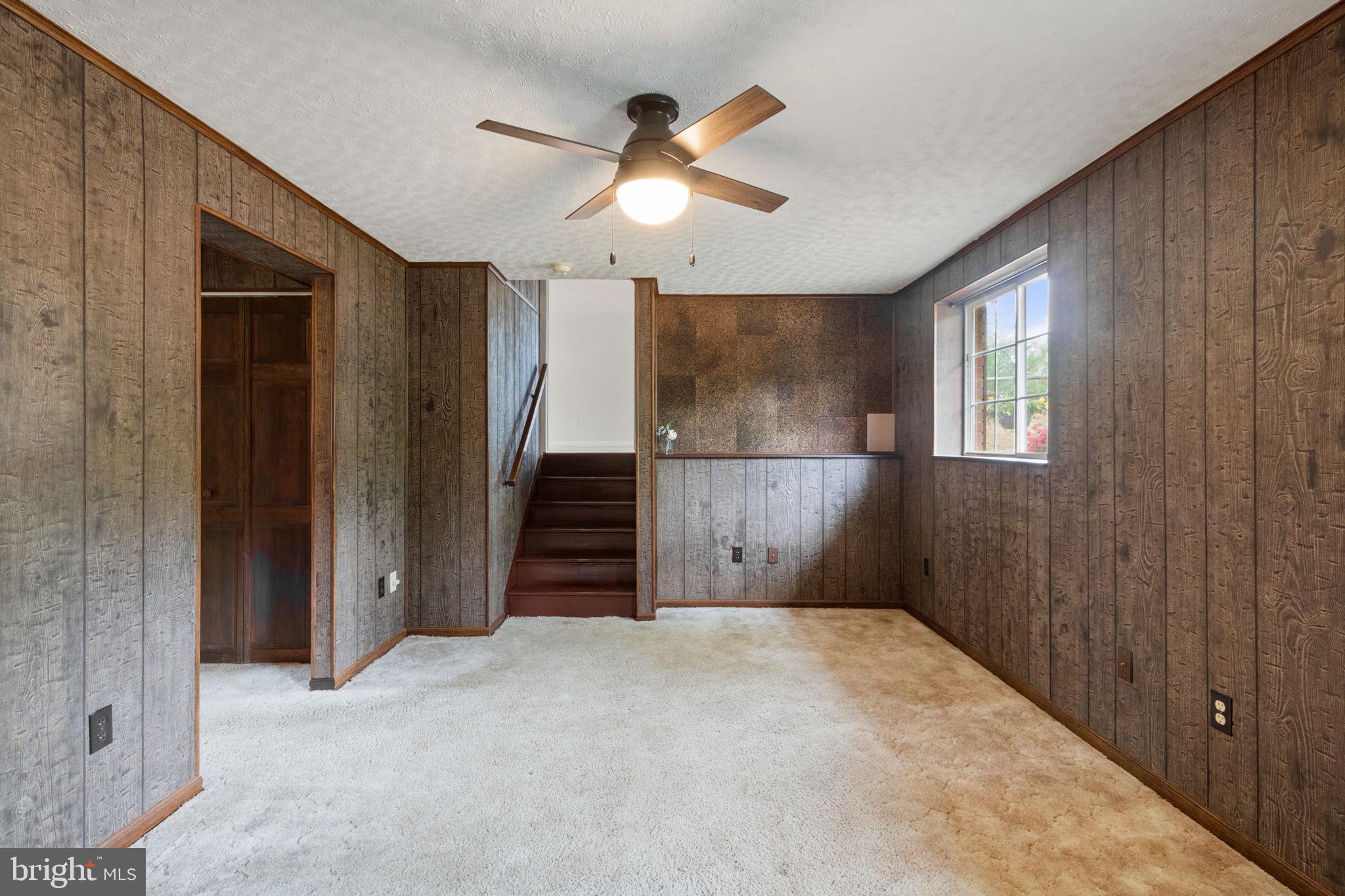 3 Cherry Laurel Drive Fredericksburg, VA 22405 - Photo 28 of 42 en empty room with windows and ceiling fan