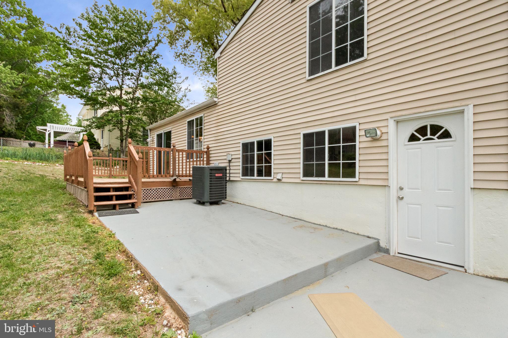 3 Cherry Laurel Drive Fredericksburg, VA 22405 - Photo 35 of 42 a backyard of a house with barbeque oven and brick wall