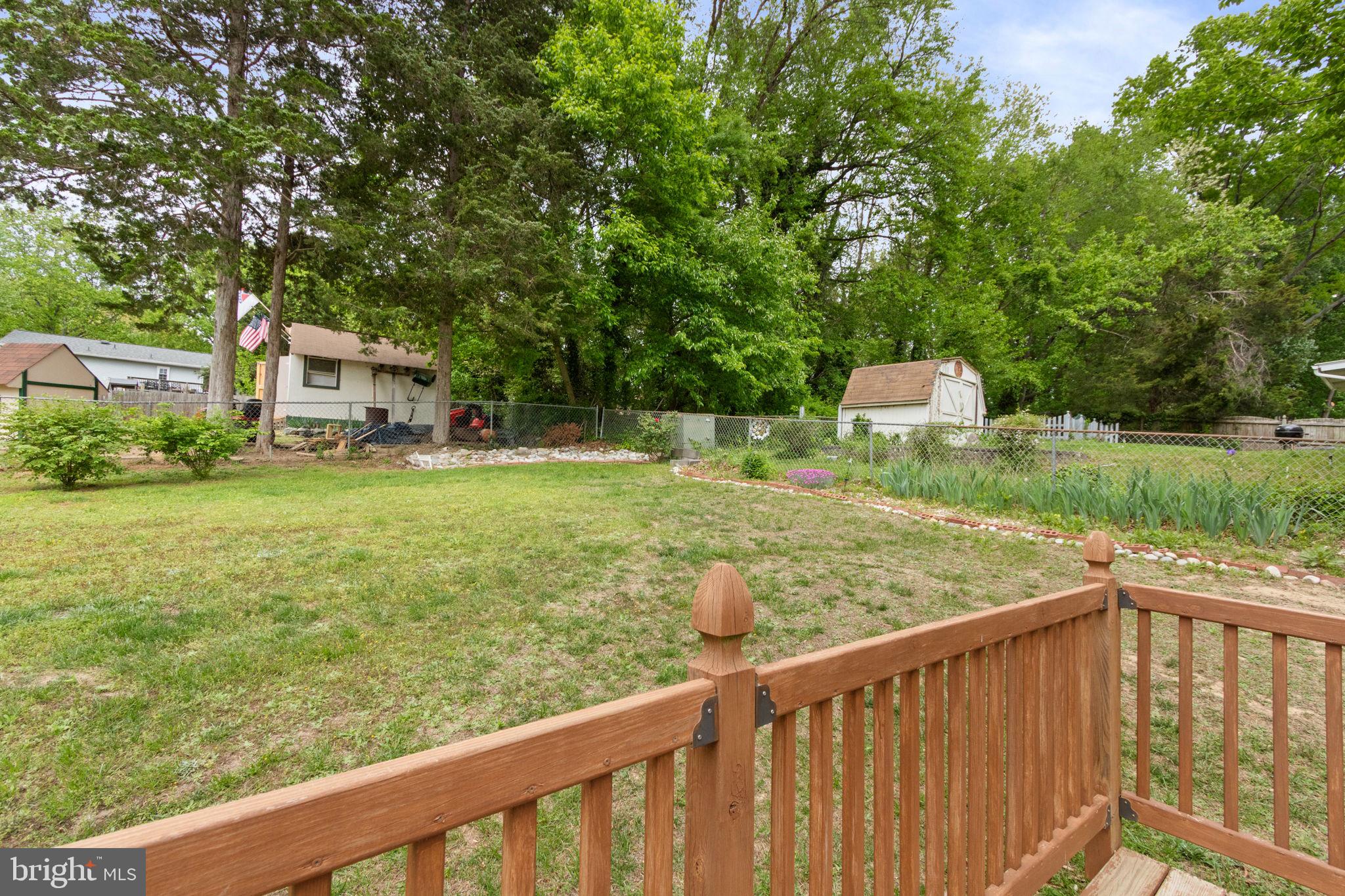 3 Cherry Laurel Drive Fredericksburg, VA 22405 - Photo 36 of 42 a view of a two chair and tables in the yard and large trees