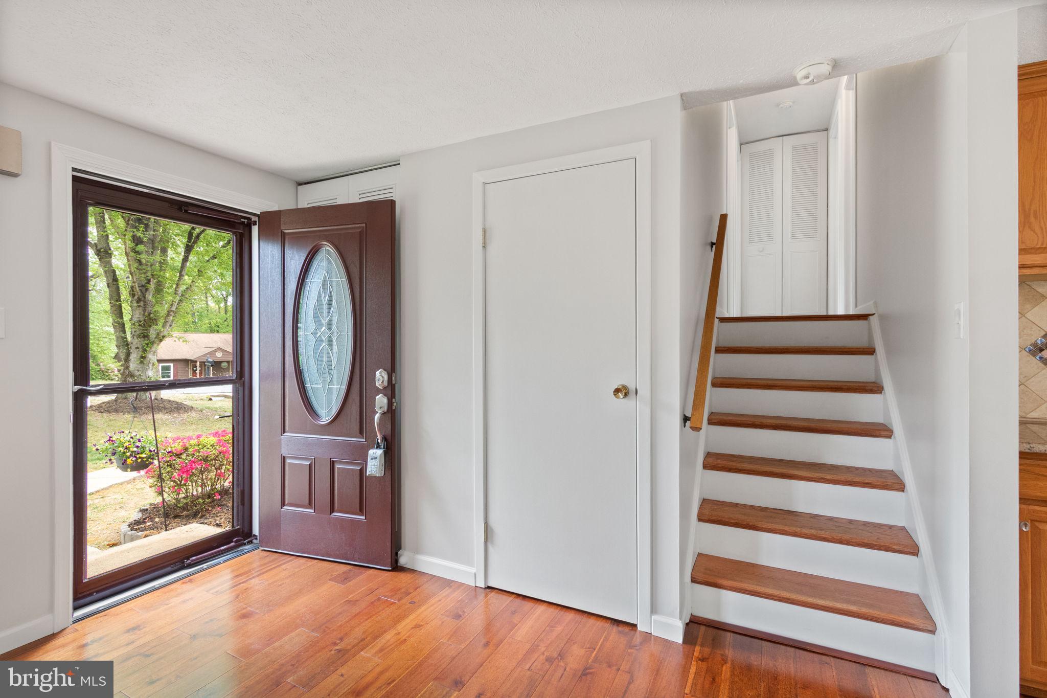 3 Cherry Laurel Drive Fredericksburg, VA 22405 - Photo 7 of 42 a view of a hallway with wooden floor and windows