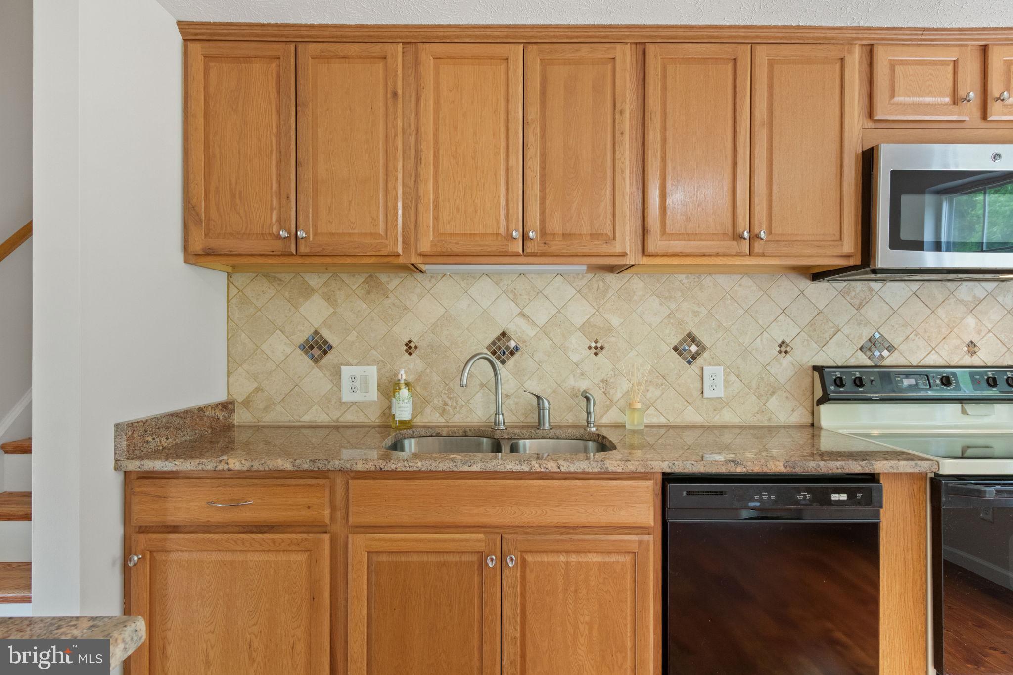 3 Cherry Laurel Drive Fredericksburg, VA 22405 - Photo 9 of 42 a kitchen with granite countertop stainless steel appliances sink and cabinets