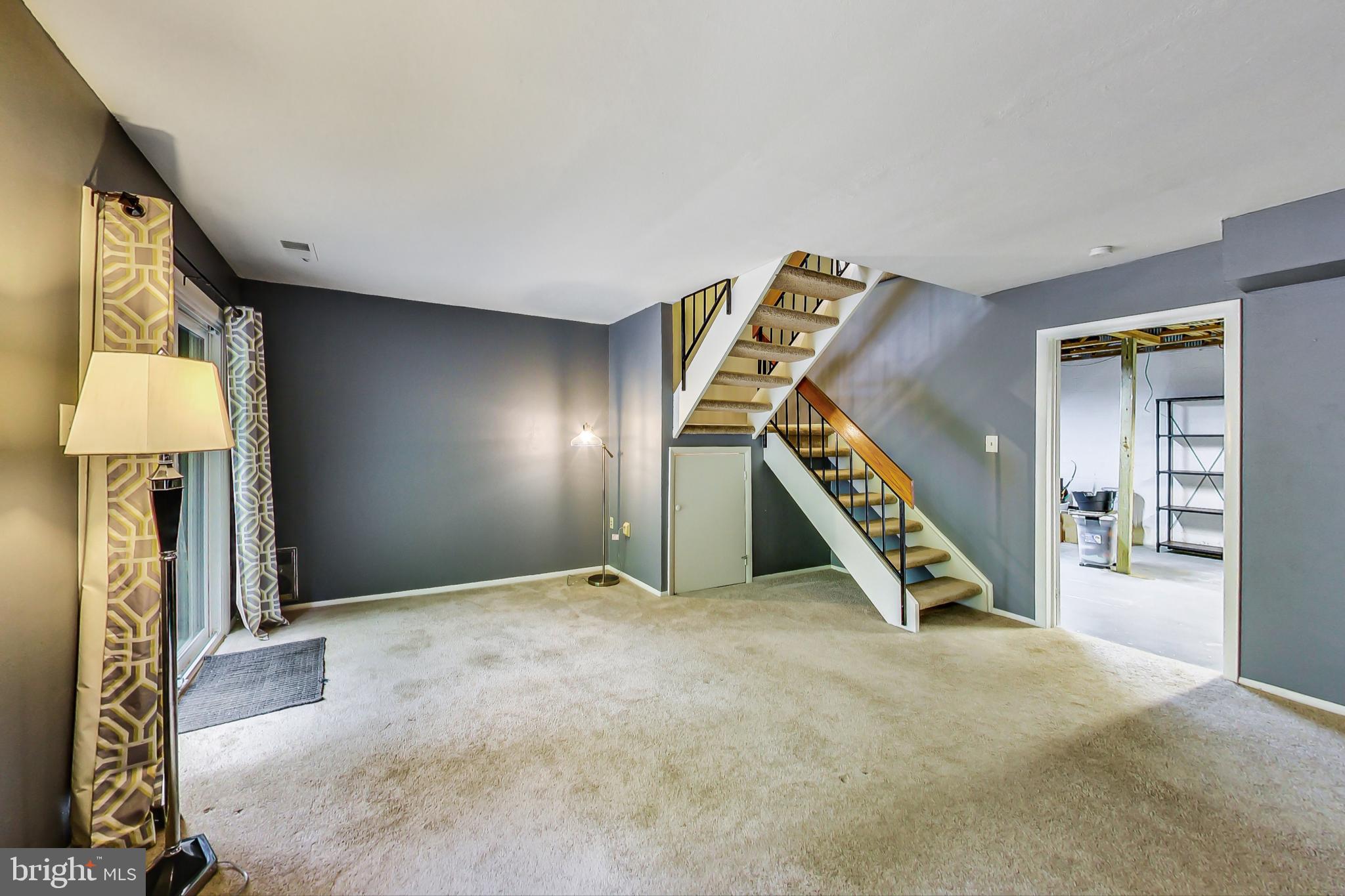 2184 Cartwright Place Reston, VA 20191 - Photo 35 of 46 Family Room has storage under the stairs
