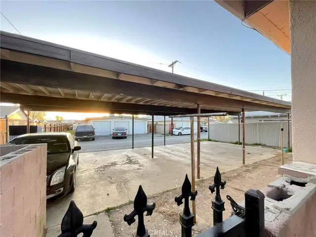 a roof deck with table and chairs
