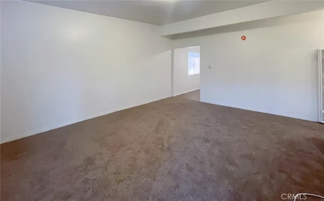 a view of an empty room and window