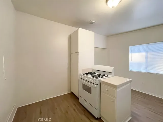 a kitchen that has a stove and a microwave