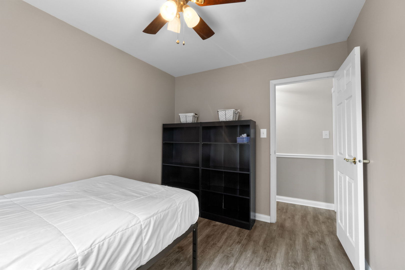 1155 Hassell Road Hoffman Estates, IL 60169 - Photo 13 of 34 a bedroom with a bed and a chandelier