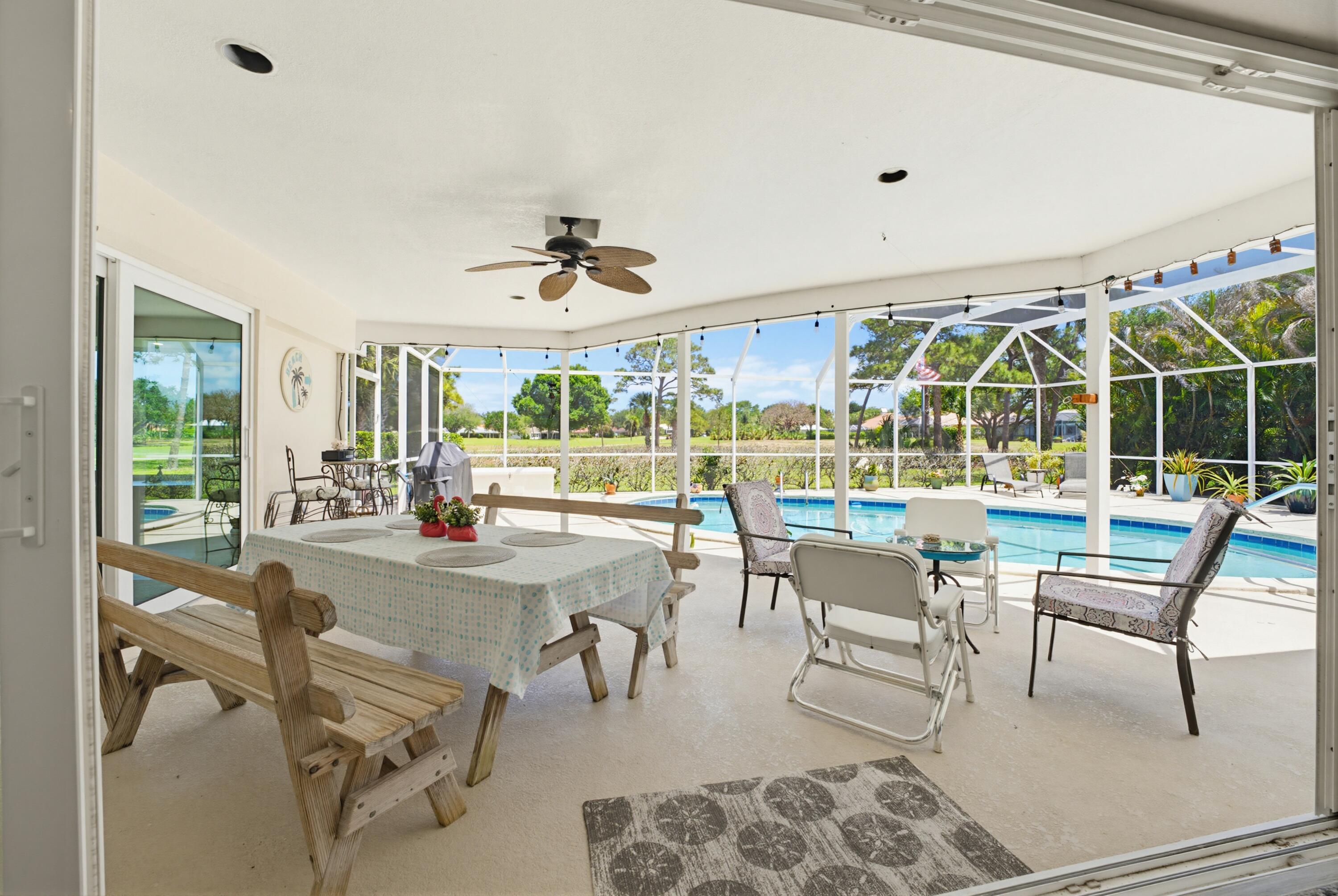 3491 Southeast Clubhouse Place Stuart, FL 34997 - Photo 11 of 43 a view of a dining area with furniture window and outside view