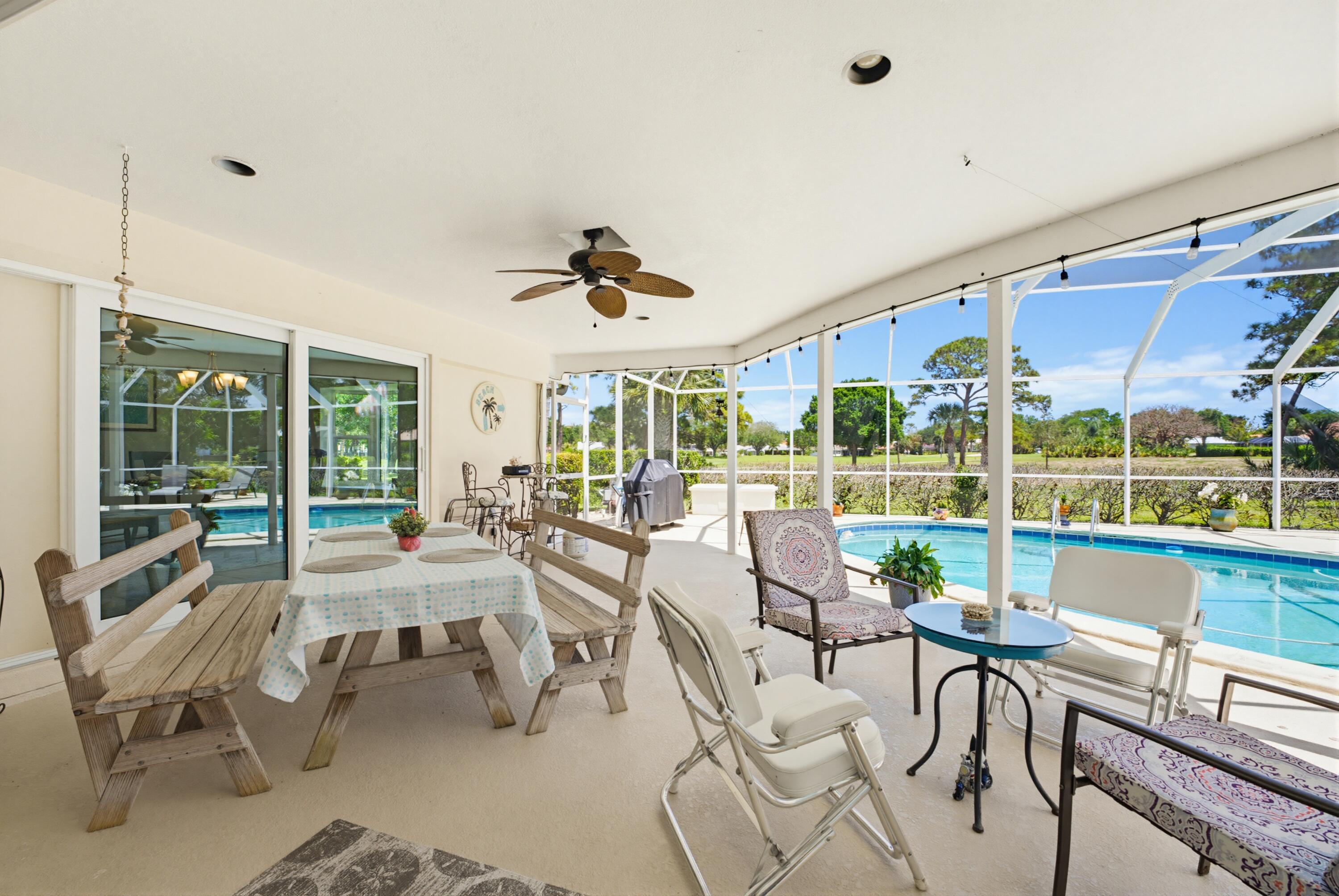 3491 Southeast Clubhouse Place Stuart, FL 34997 - Photo 12 of 43 a view of a dining room with furniture window and outside view