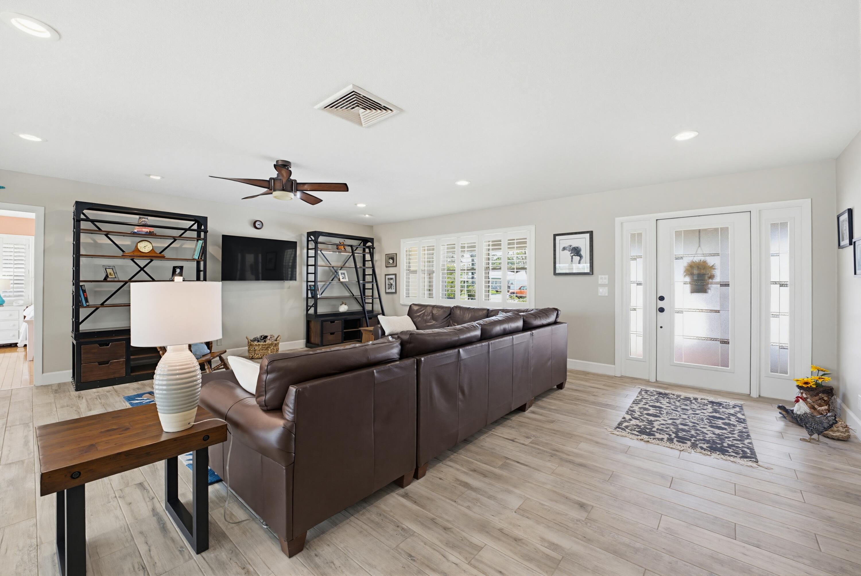3491 Southeast Clubhouse Place Stuart, FL 34997 - Photo 22 of 43 a living room with furniture