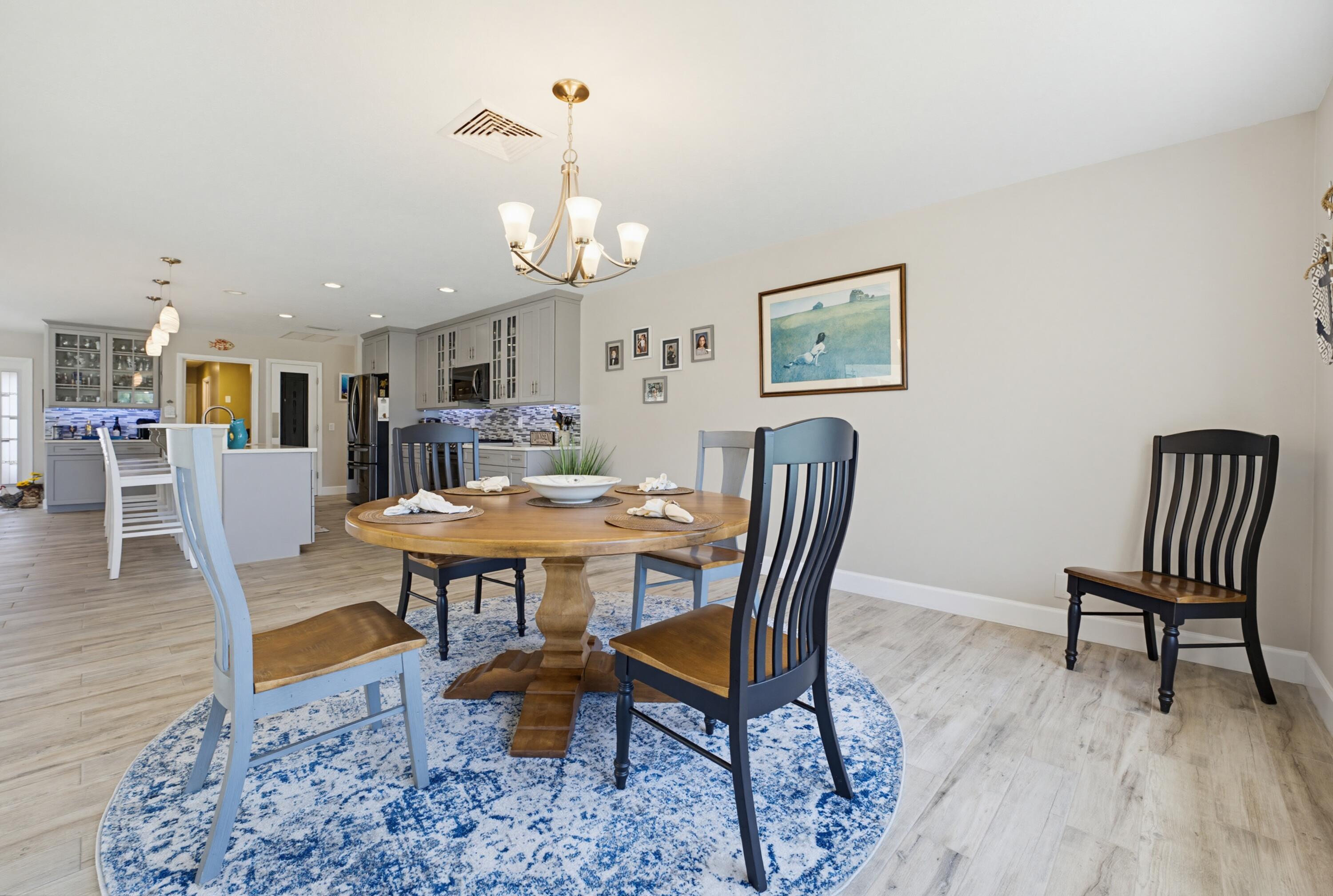 3491 Southeast Clubhouse Place Stuart, FL 34997 - Photo 24 of 43 a view of a dining room with furniture