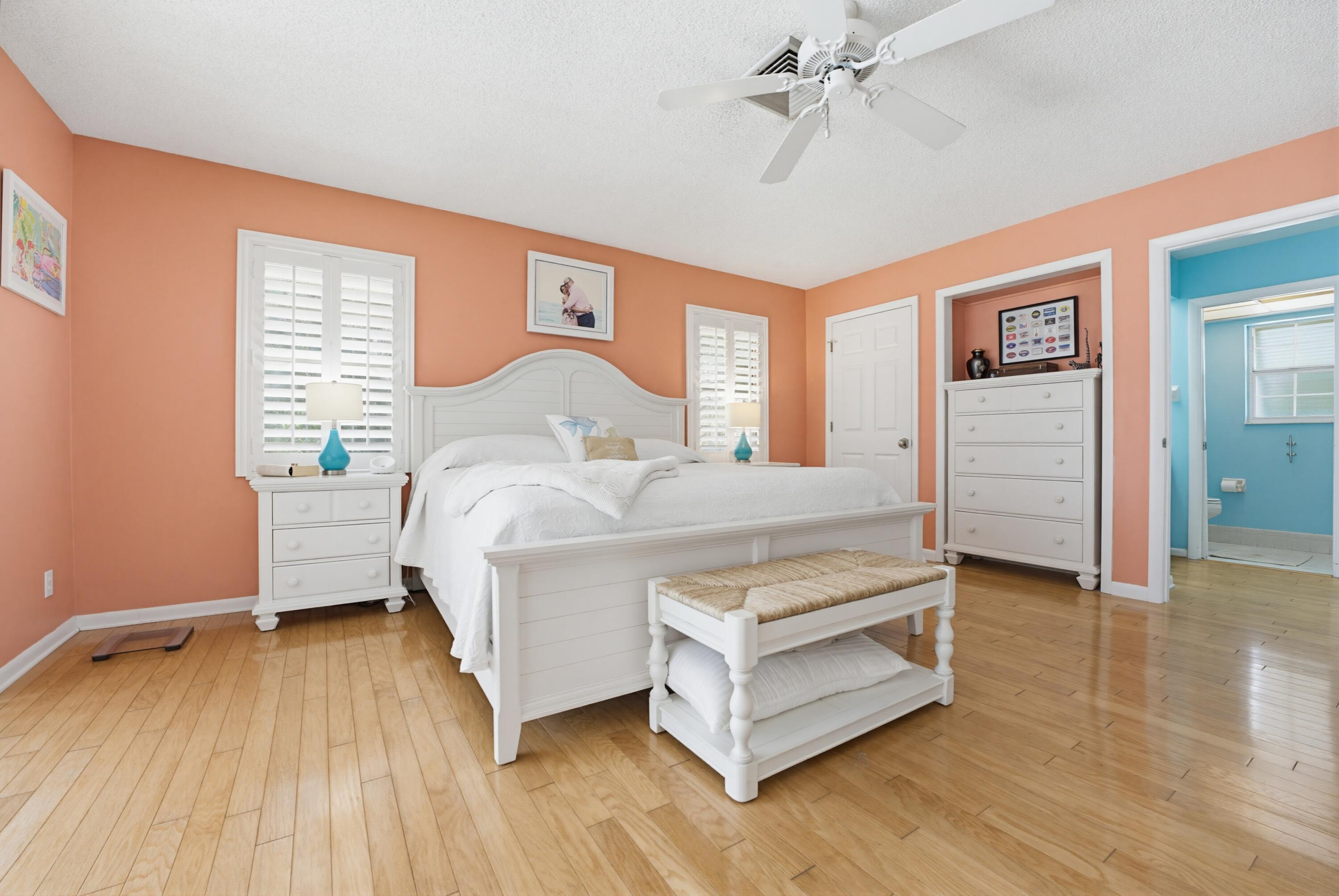 3491 Southeast Clubhouse Place Stuart, FL 34997 - Photo 26 of 43 a bedroom with a bed and a dresser