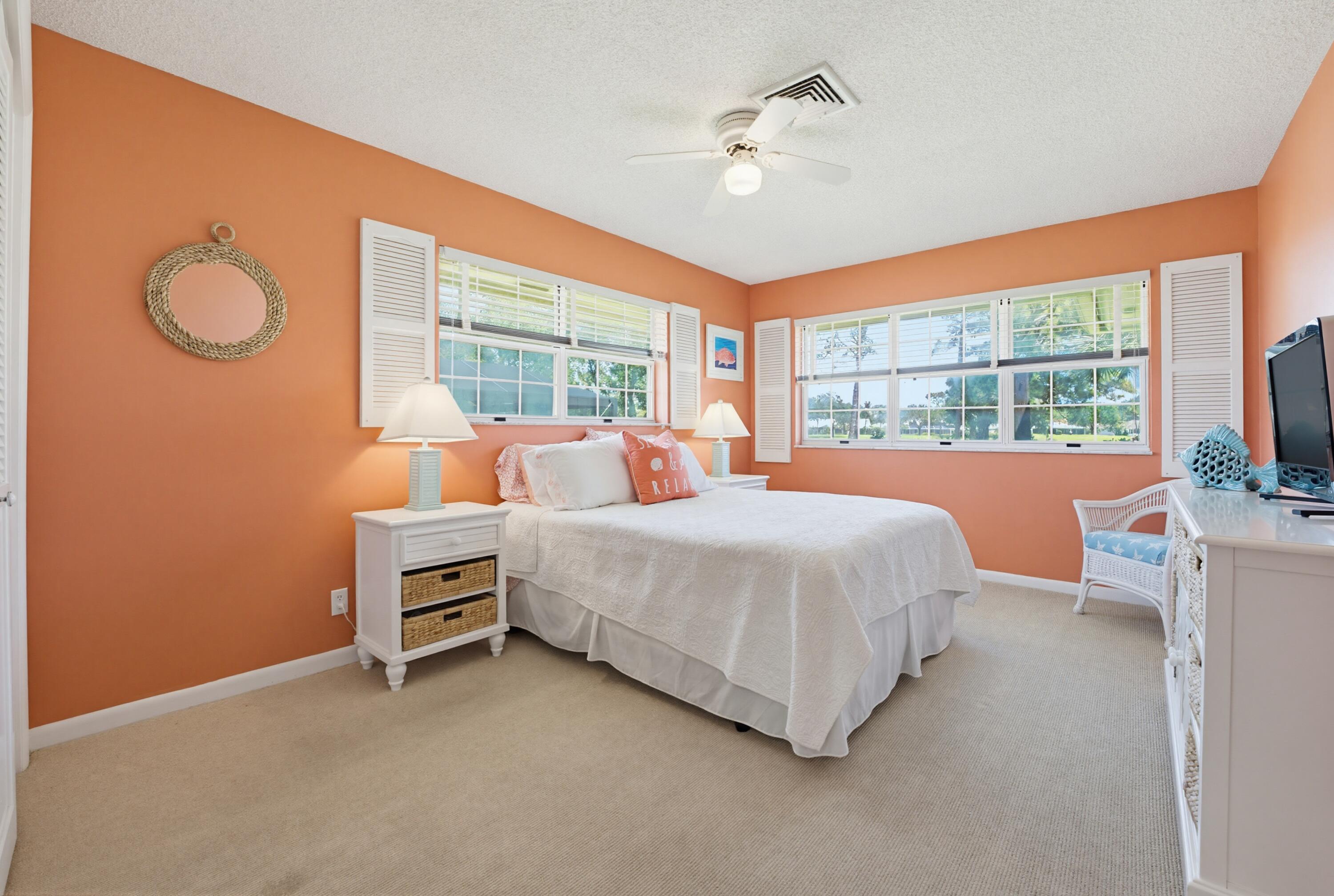 3491 Southeast Clubhouse Place Stuart, FL 34997 - Photo 28 of 43 a bedroom with bed and a large window