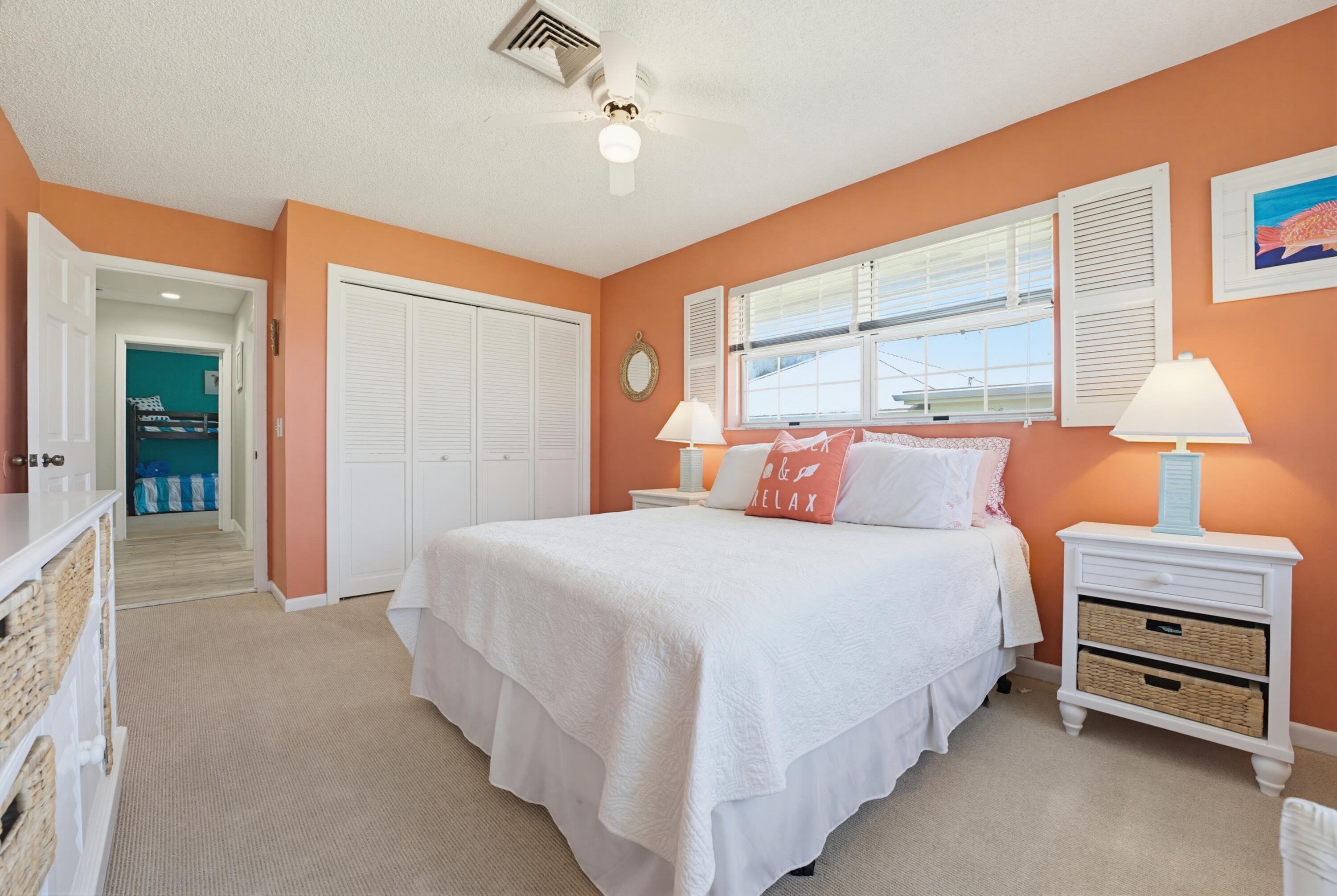3491 Southeast Clubhouse Place Stuart, FL 34997 - Photo 29 of 43 a bedroom with a bed and a cabinets