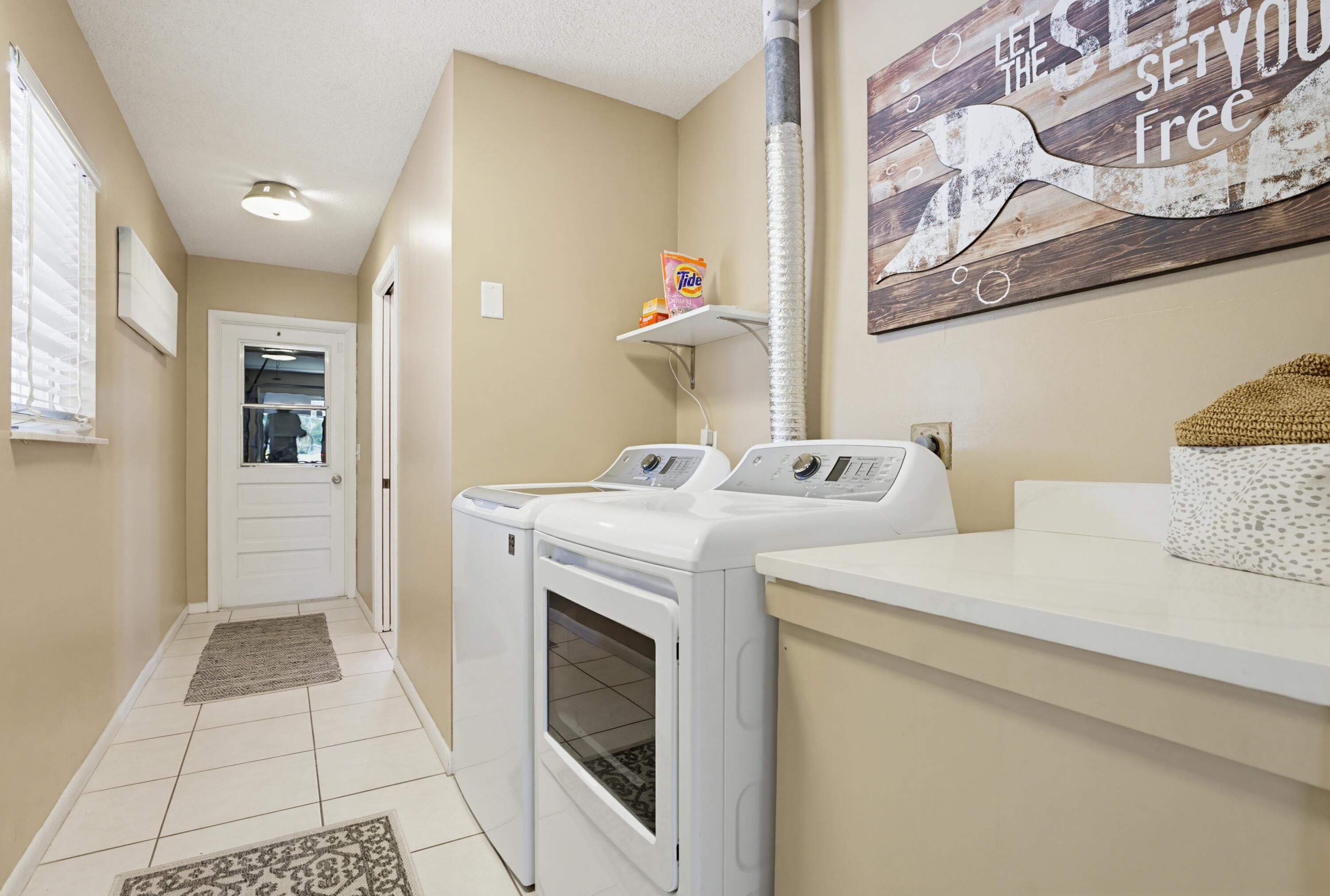 3491 Southeast Clubhouse Place Stuart, FL 34997 - Photo 37 of 43 a utility room with dryer and washer