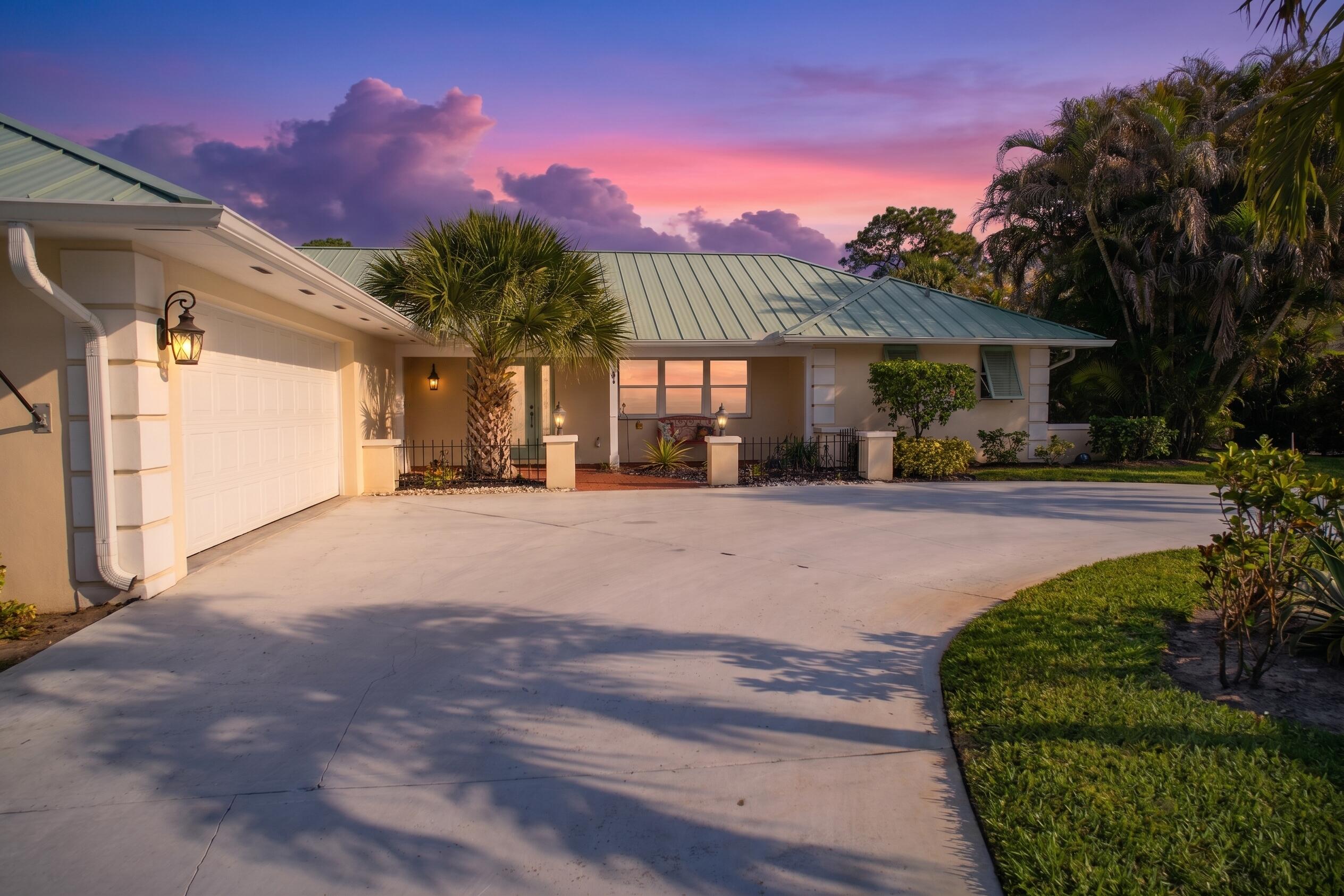 3491 Southeast Clubhouse Place Stuart, FL 34997 - Photo 38 of 43 a view of a house with a yard