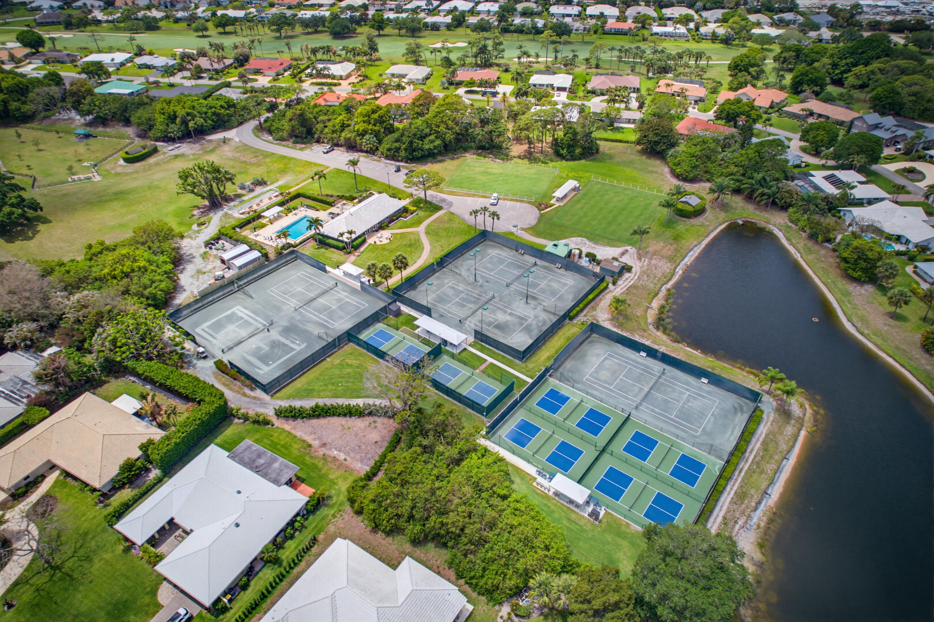 3491 Southeast Clubhouse Place Stuart, FL 34997 - Photo 43 of 43 an aerial view of a house with a garden