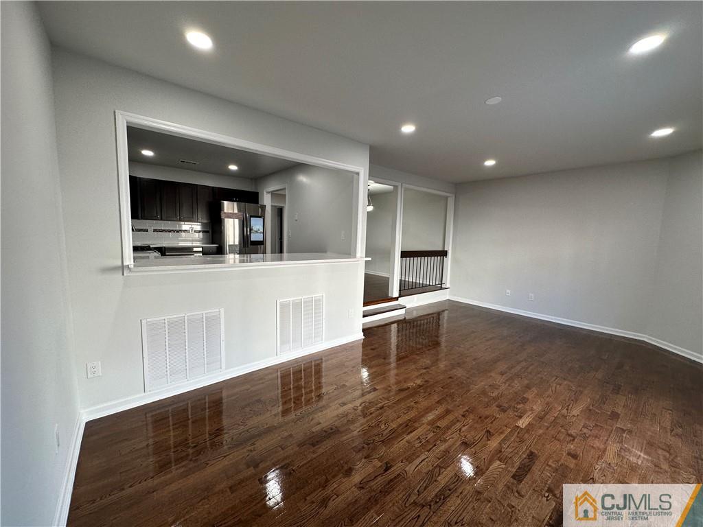 3703 Hana Road Edison, NJ 08817 - Photo 15 of 55 a kitchen with stainless steel appliances a refrigerator and a stove top oven