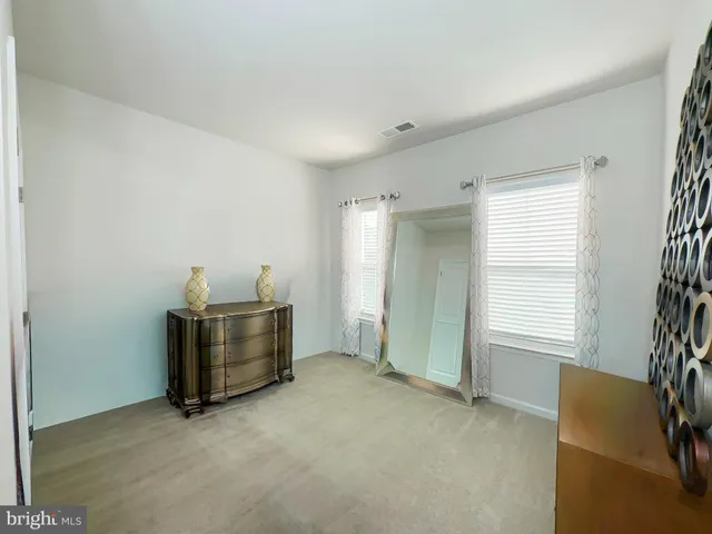 a view of room with window and furniture